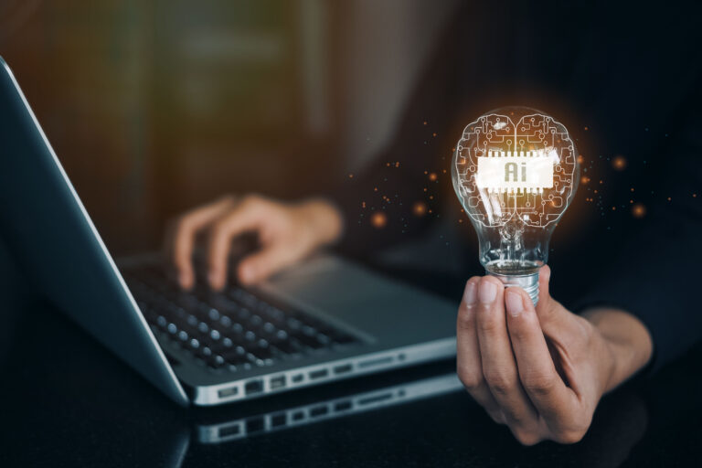 Person holding lightbulb with AI.