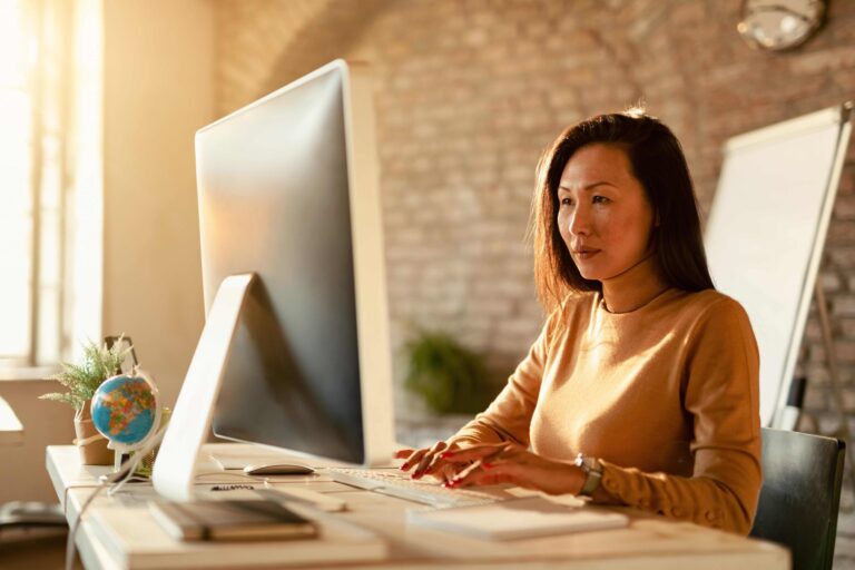 Technical Writer at her desk