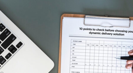 A checklist to review, placed on a clipboard near a laptop.