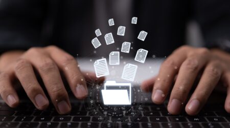 Hands on keyboard, AI transforming technical documentation.