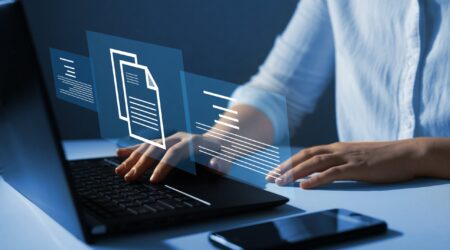 digital file with sub topics and hands on keyboard.