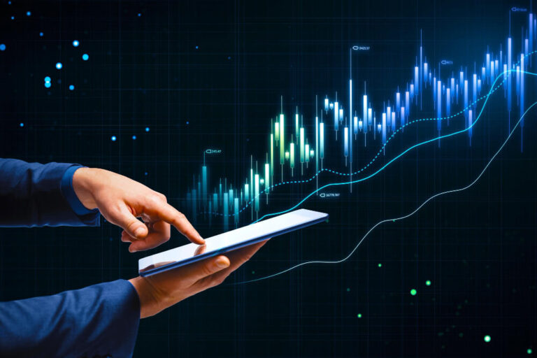 Person touching a tablet and a spending chart showing less spending and more growth over time.