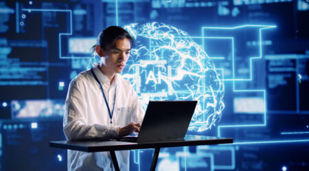 IT worker on computer with digital screen behind him that says AI.