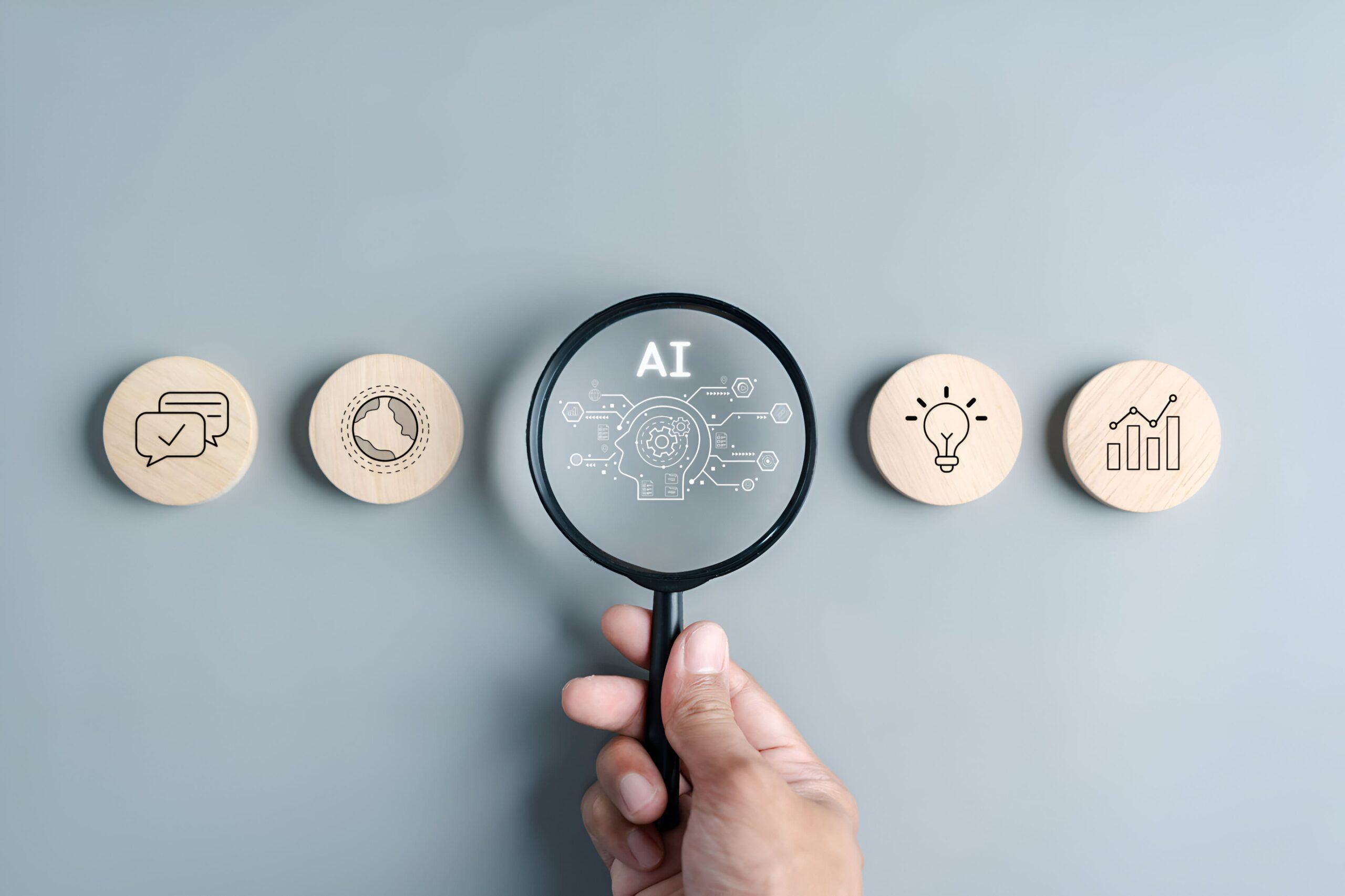 magnifying glass over AI with round tokens on both sides with analytics and messages and lightbulbs.