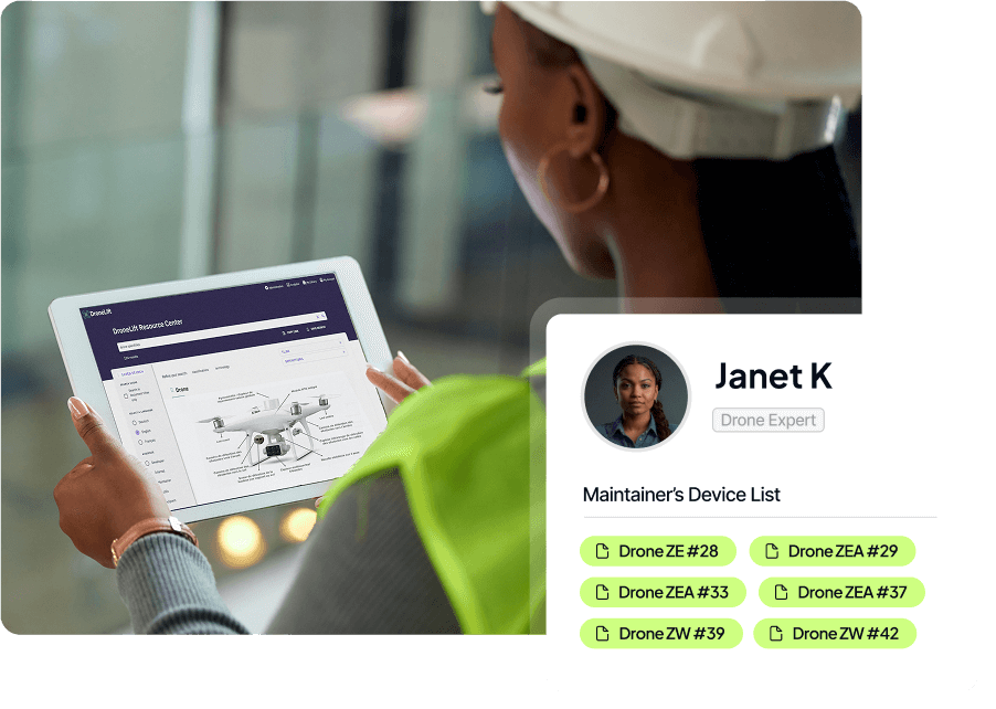 A person wearing a hard hat and green vest is looking at a tablet displaying a drone maintenance dashboard, with a device list that includes various drones.