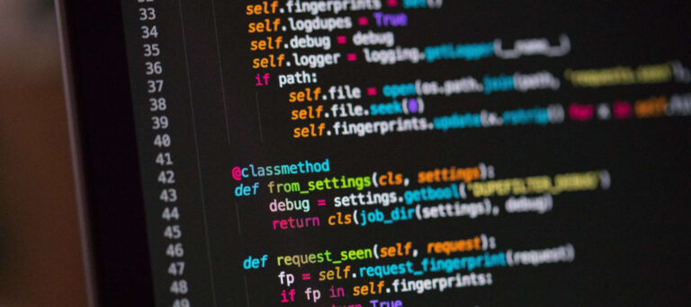 Close-up of code on computer screen with colorful syntax highlighting.