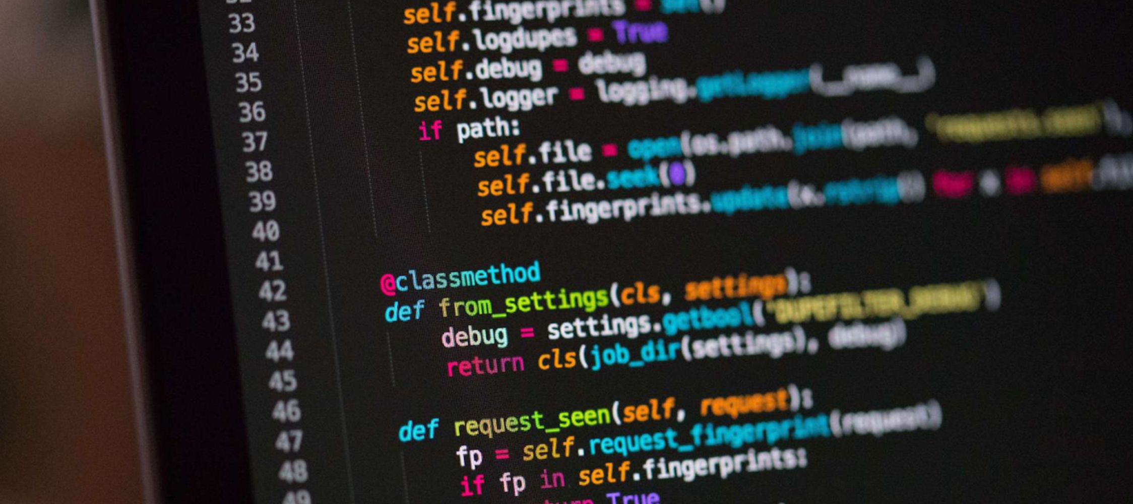 A close-up view of code displayed on a computer screen, showcasing syntax highlighting in various colors.
