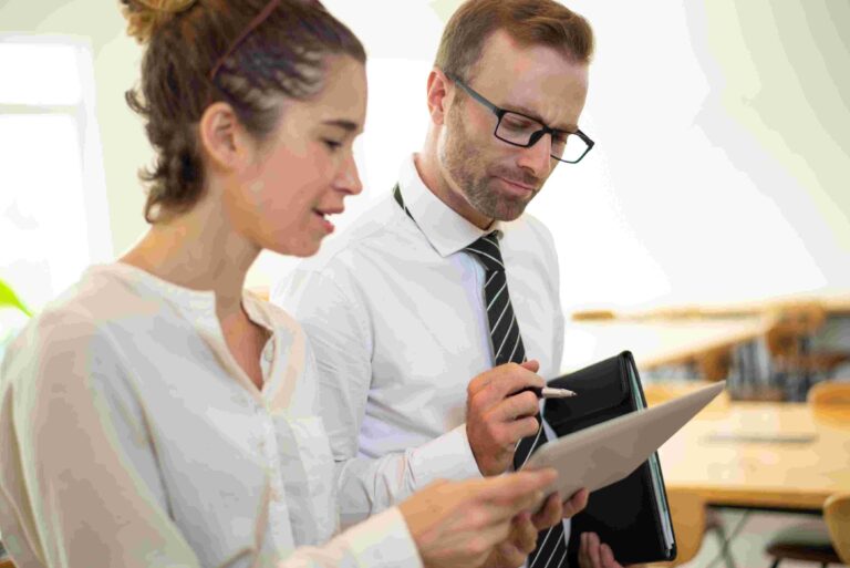 QA managers looking at a computer