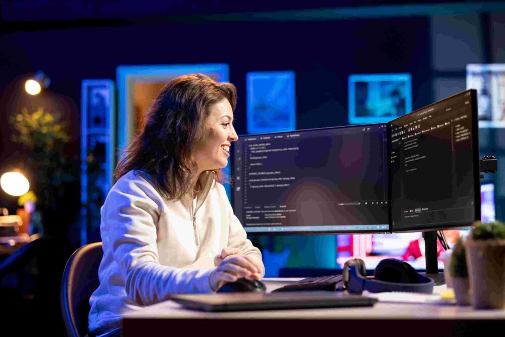 Joyous developer on computer.