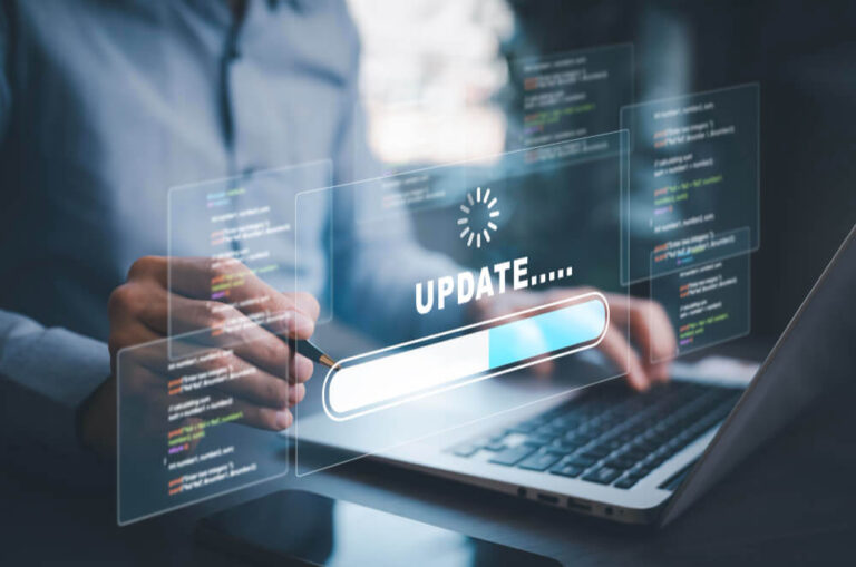 Person using laptop with digital 'UPDATE' progress bar on transparent screen, futuristic vibe.