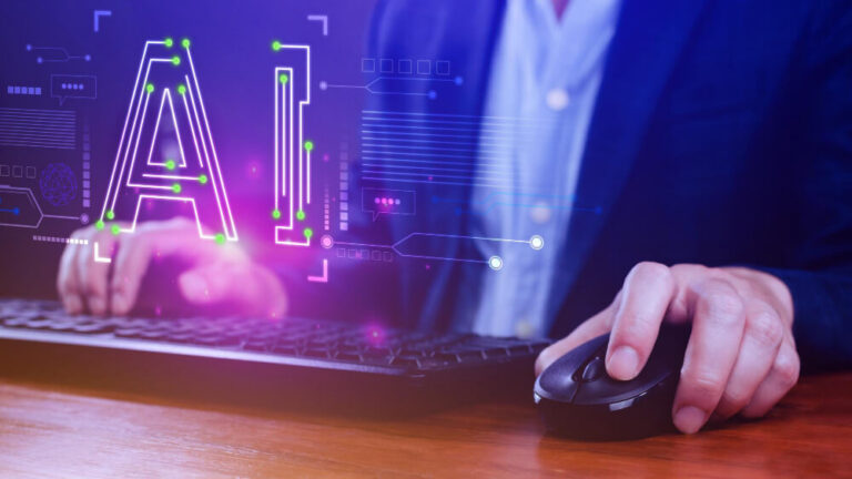 Person typing on computer with a futuristic "AI" over the image.